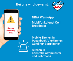 Man sieht ein Handy, in dem auf den Warntag am 10. September um 11 Uhr hingewiesen wird